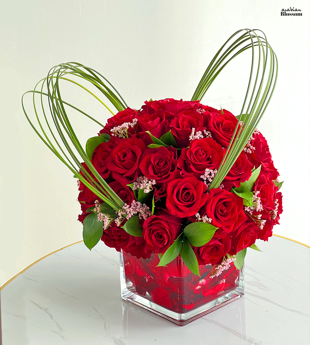 Red roses in a cube vase